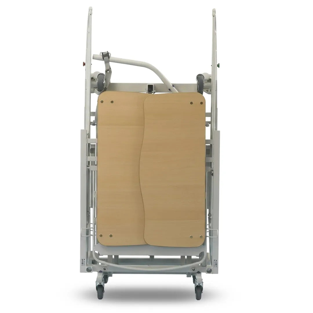 Vista plegada de la cama médica articulada con altura variable para mejorar la ergonomía del cuidador dortomedical
