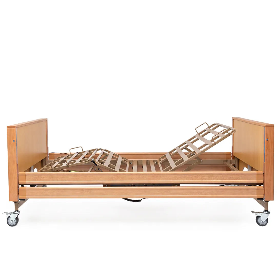 Vista lateral de la cama articulada con elevación de cuatro planos articulados para ajustar la posición al usuario dortomedical