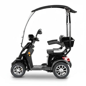 Vista lateral de moto eléctrica negra para movilidad reducida con neumáticos de 10 pulgadas y frenos hidráulicos dortomedical
