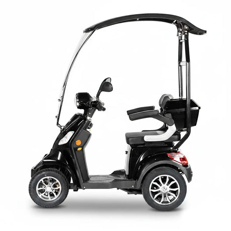 Vista lateral de moto eléctrica negra para movilidad reducida con neumáticos de 10 pulgadas y frenos hidráulicos dortomedical